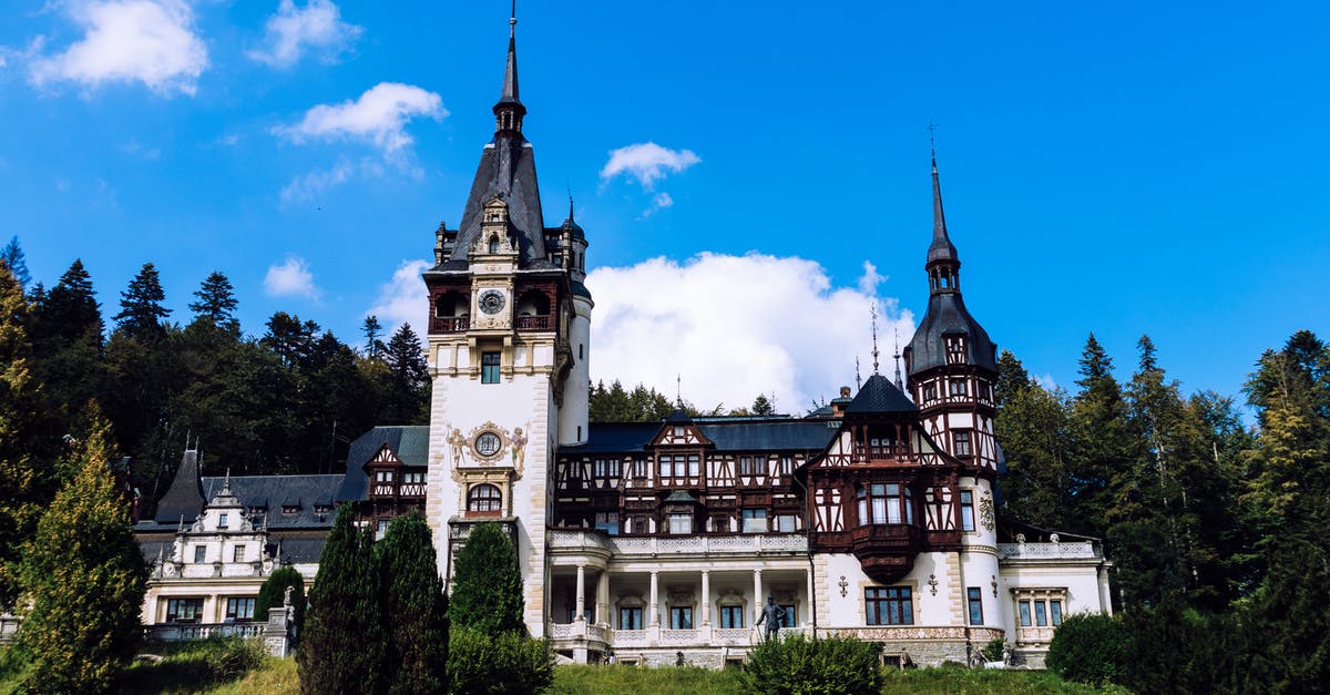 Transit visa for Romania - White and Brown Concrete Building Under Blue Sky