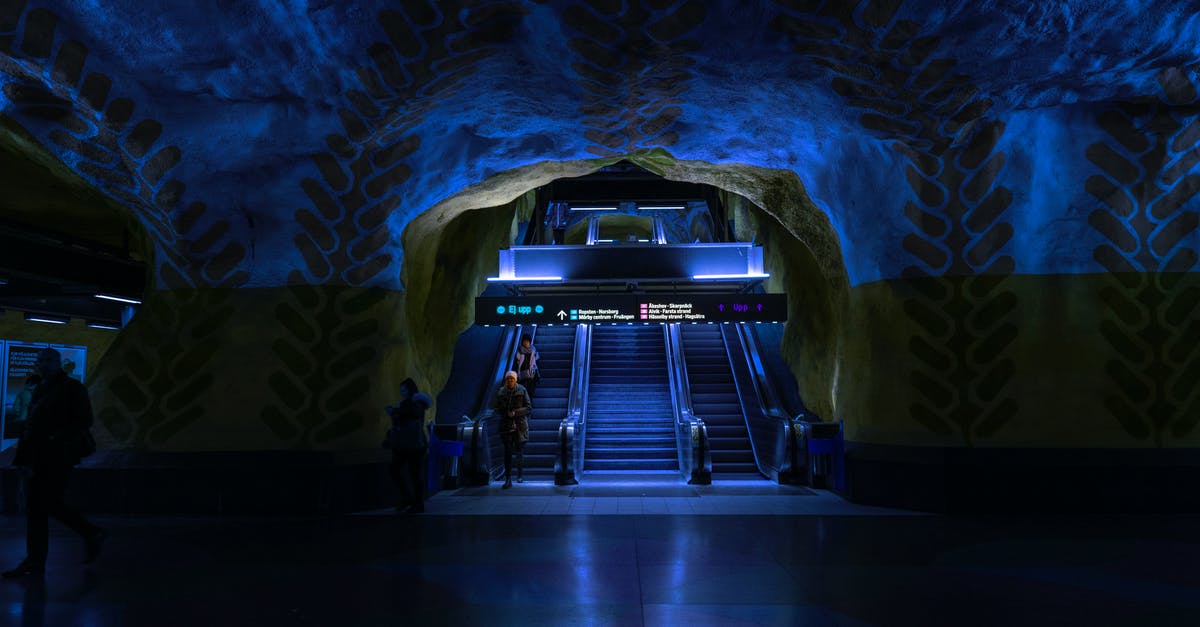 Transit Visa for Stockholm [duplicate] - Blue and Black Escalator Inside a Tunnel