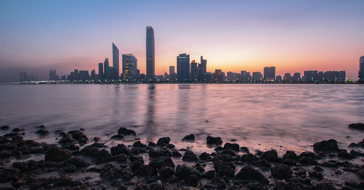 Transit Visa of Abu dhabi to travel Dubai - Skyscrapers Near Body of Water