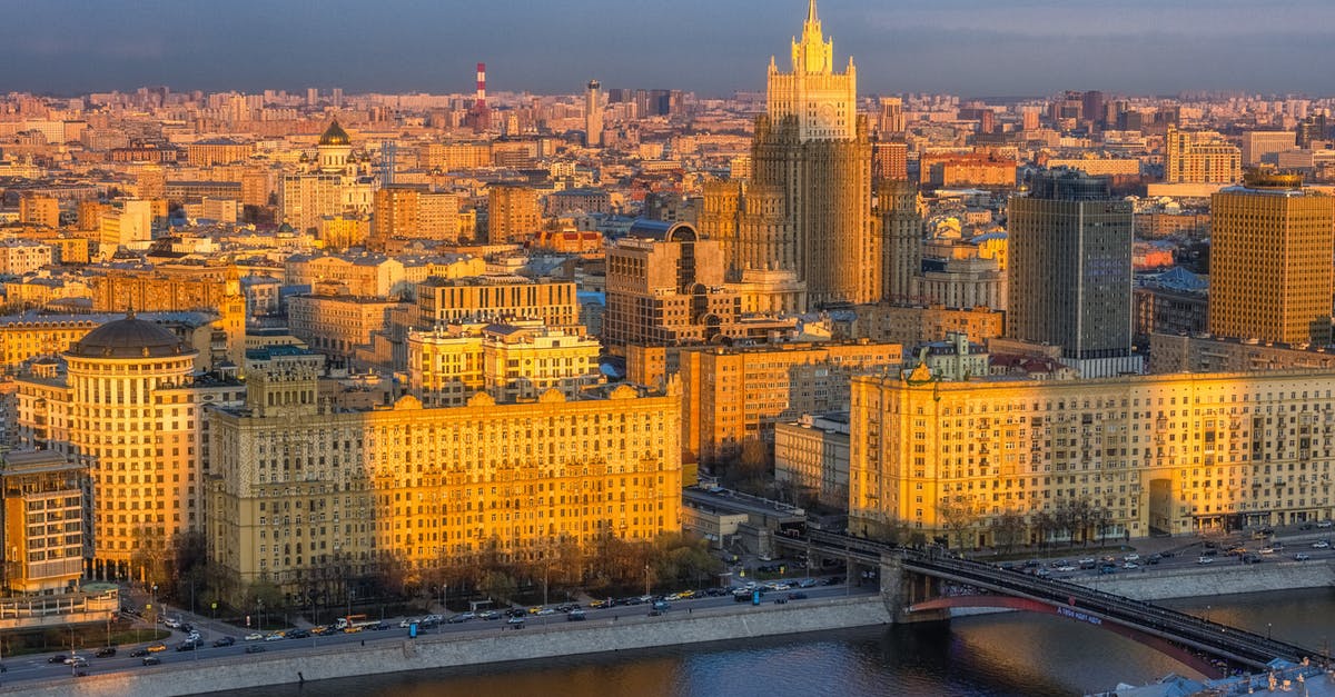 Transiting via Moscow & Havana [closed] - An Aerial Photography of City Buildings Near the Body of Water