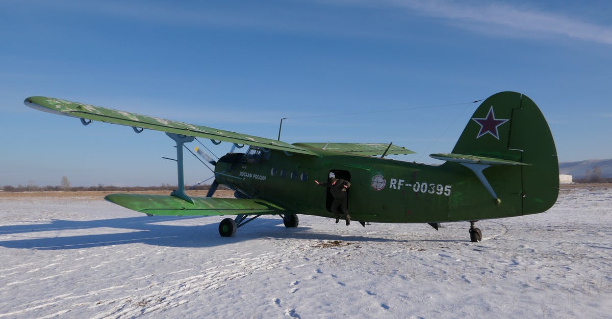 Transport frozen mother's milk by plane - Biplane on snowy ground in nature