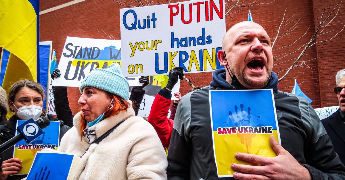 Transportation between Russia and Ukraine - People Holding Anti-War Signs and Protesting in the Street