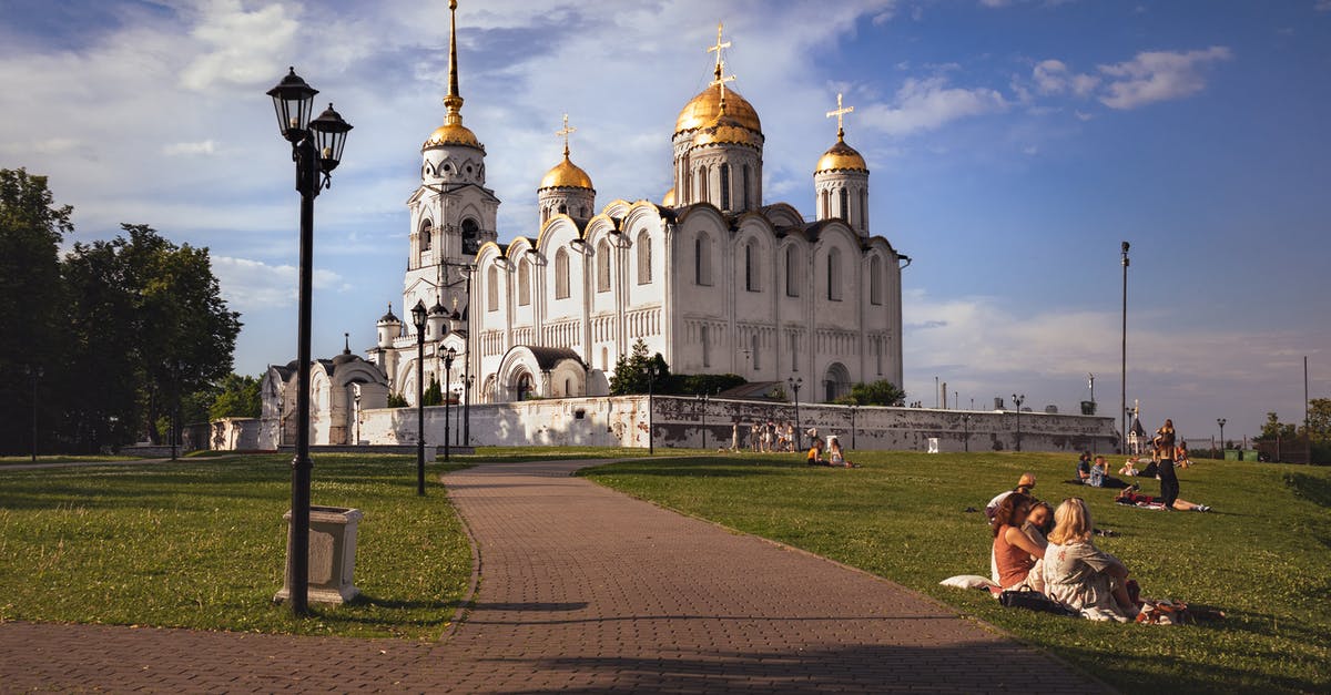 Travel Europe to Russia - White and Brown Concrete Building Under Blue Sky