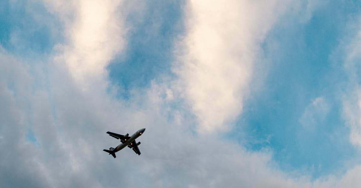 Travel from domestic- international (Japan) with Air China in Beijing [closed] - Aircraft flying in cloudy blue sky