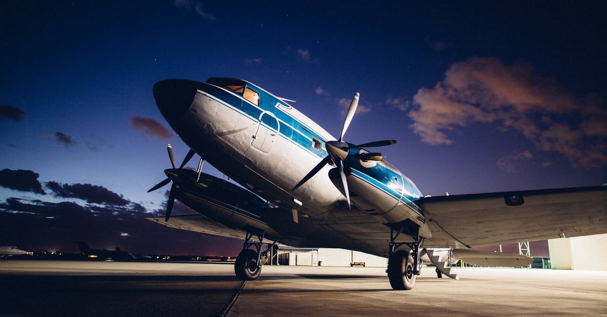 Travel from Gimpo airport to Incheon airport during night - Airplane with propellers on aerodrome