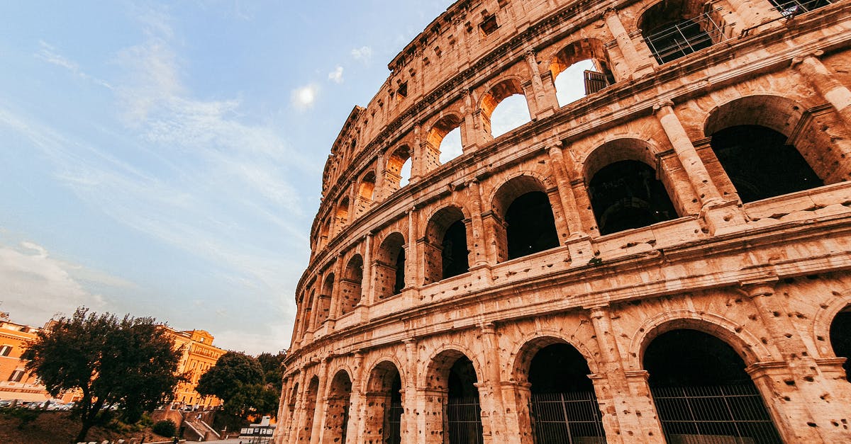 Travel from the UK to Spain with an Italian ID - Facade of ancient landmark with arches