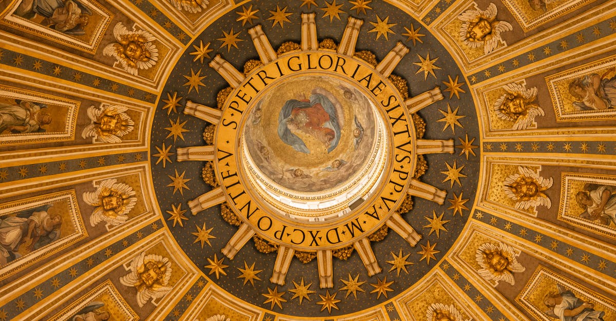 Travel from the UK to Spain with an Italian ID - From below wonderful ornamental design of ancient dome inside St. Peters Basilica in Rome