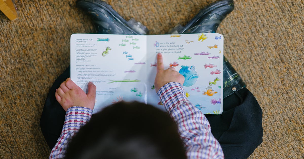 Travel Guide book for Asia with toddler/ young children? - Photo of a Boy Reading Book