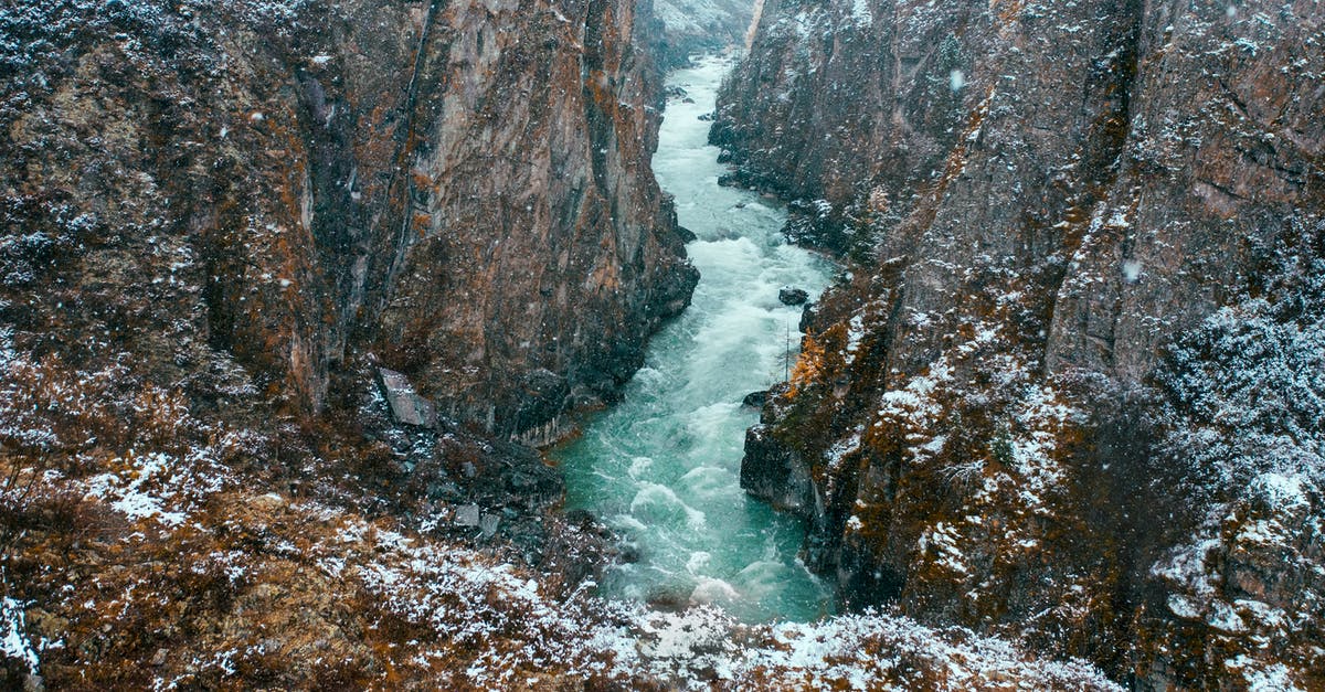 Travel in Scandinavia during autumn - River Between Rocky Mountains