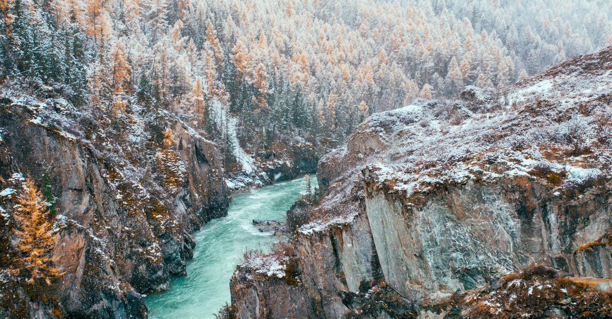 Travel in Scandinavia during autumn - Brown Rocky Mountain Beside River