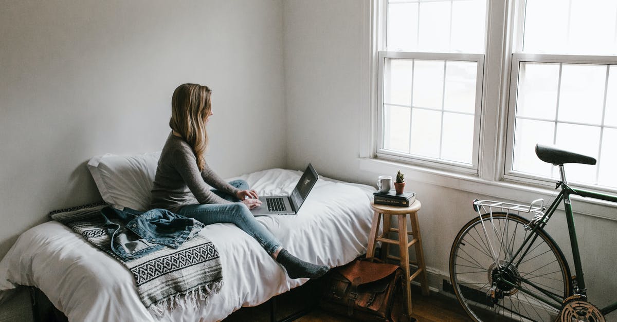 Travel inside the EU with expired student visa - Woman in Gray Shirt Sitting on Bed