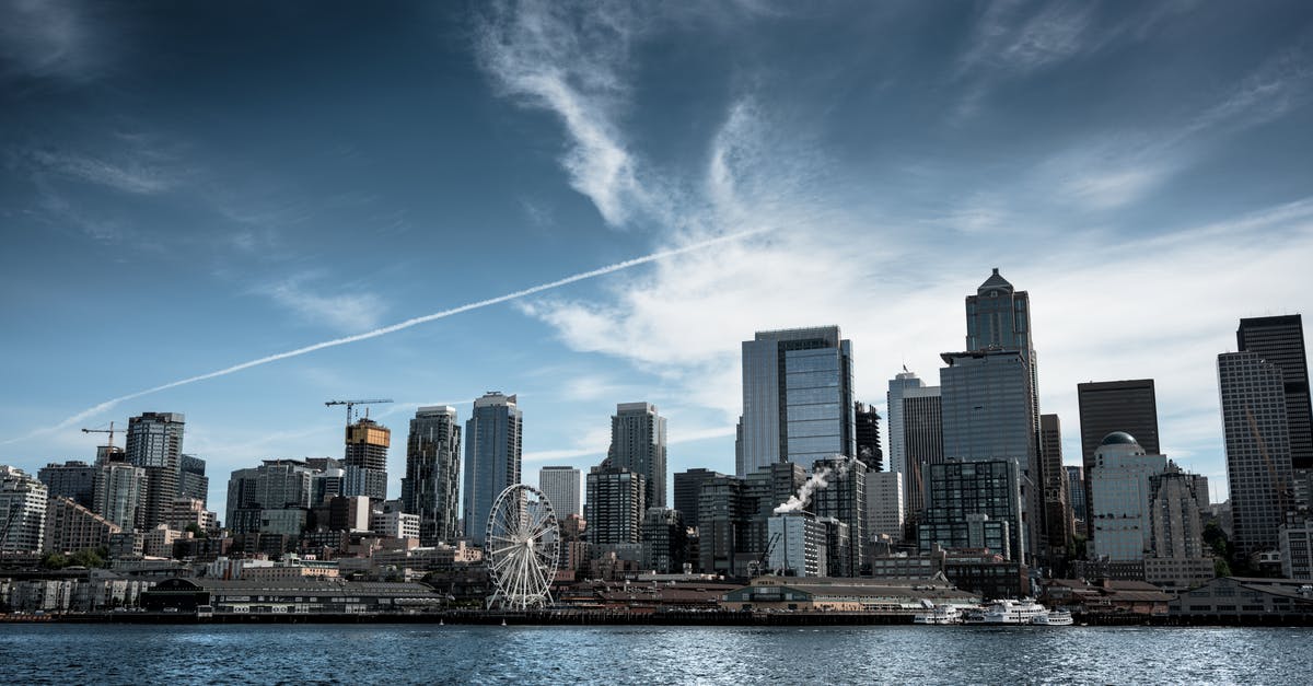 Travel options from nuremberg to Seattle - Photo of White Ferris Wheel Across City Buildings