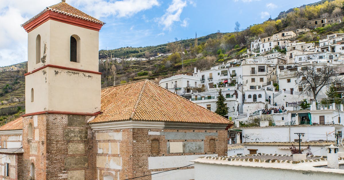 Travel options from Spain to Gibraltar [closed] - A Chapel and White Buildings in a Town in Spain