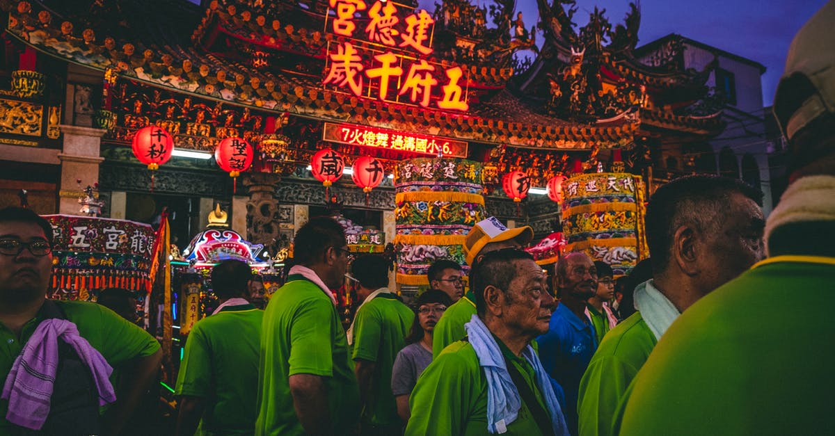 Travel through Chinese/Korean immigration/customs individually or together? - Parade of People Wearing Green Shirts