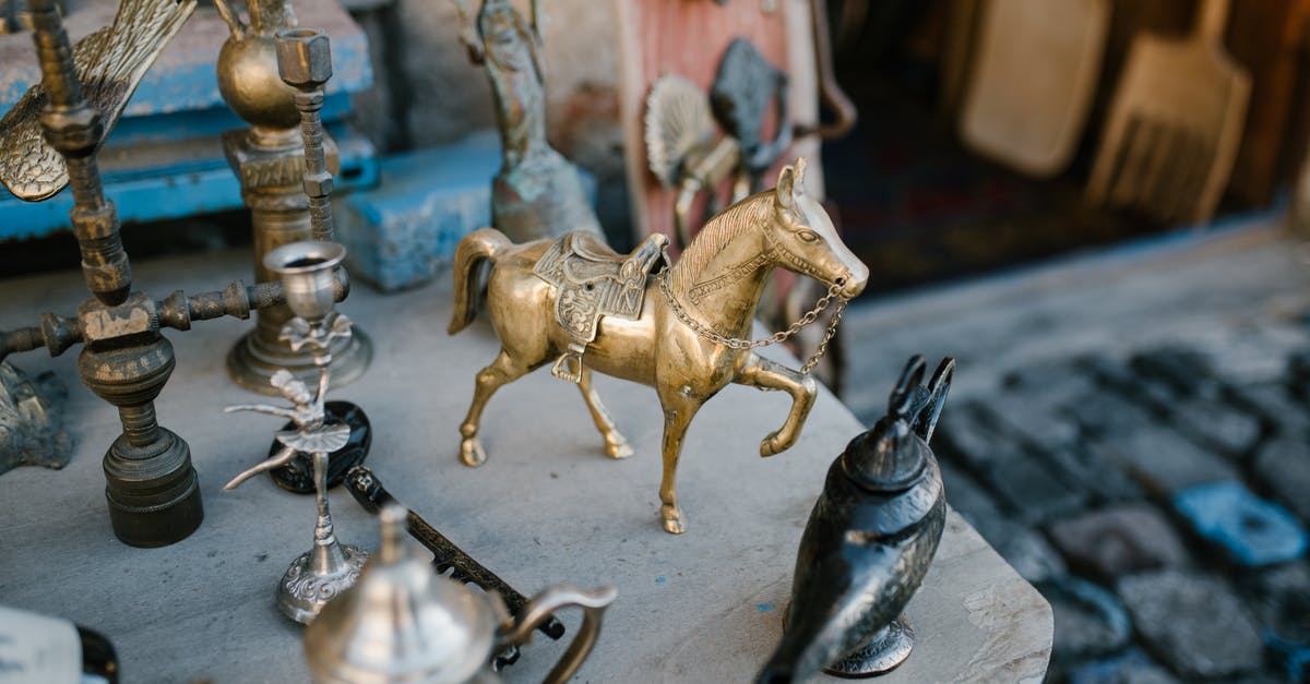 Travel to Altiplano (Bolivia) from Villazon without a local tour? - High angle many copper and metal oriental souvenirs arranged on stall in local street market