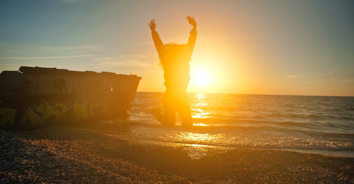 Travel to Ercan enroute Larnaca - Person Jumping on Seashore during Golden Hour