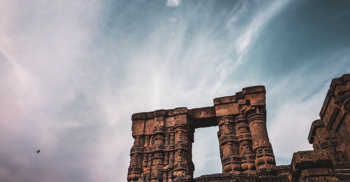 Travel to Mexico from India - Architectural details of old Hindu temple under cloudy sky