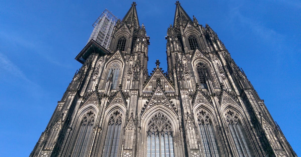 Travel to Portugal from Cologne, Germany [closed] - Facade of Cathedral Against Blue Sky