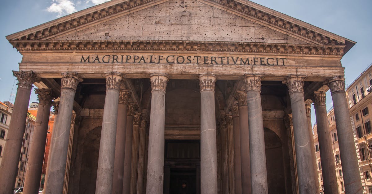 Travel to rome 4 days before my visa expires - Ancient building in street with tourists walking nearby