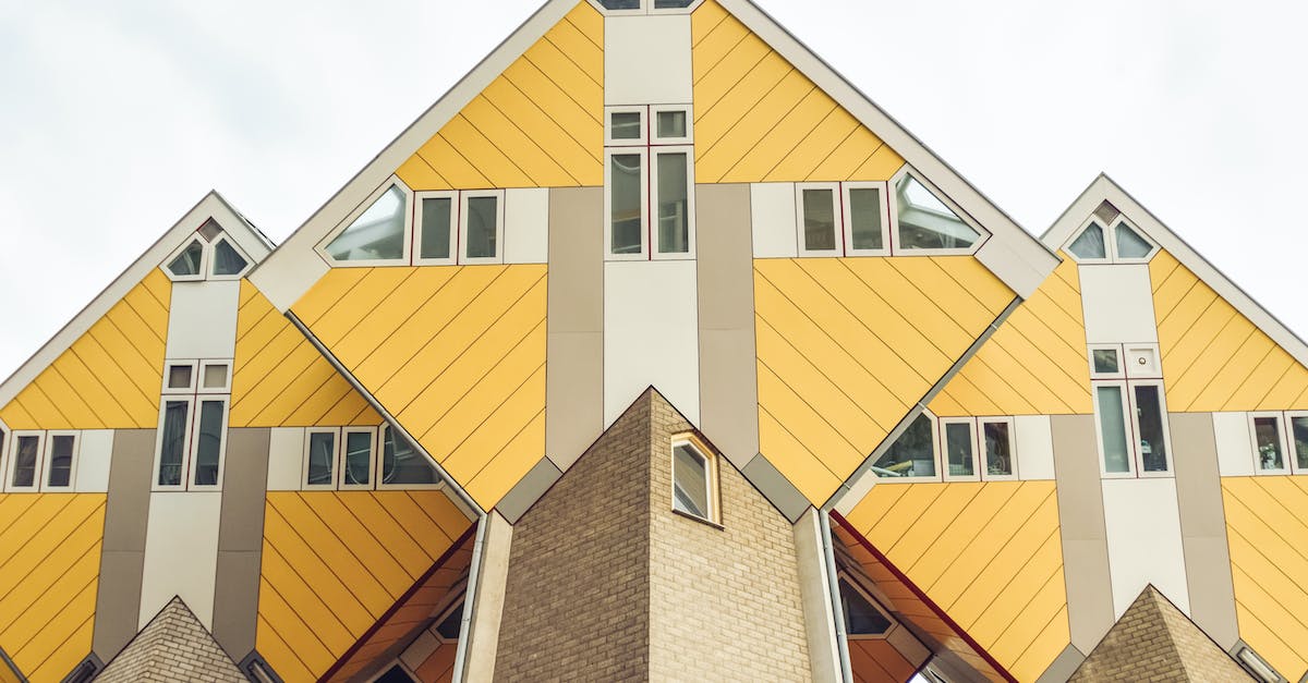 Travel with a baby from Eindhoven to Maasbree in the Netherlands - Creative hexagon shaped houses against cloudy sky
