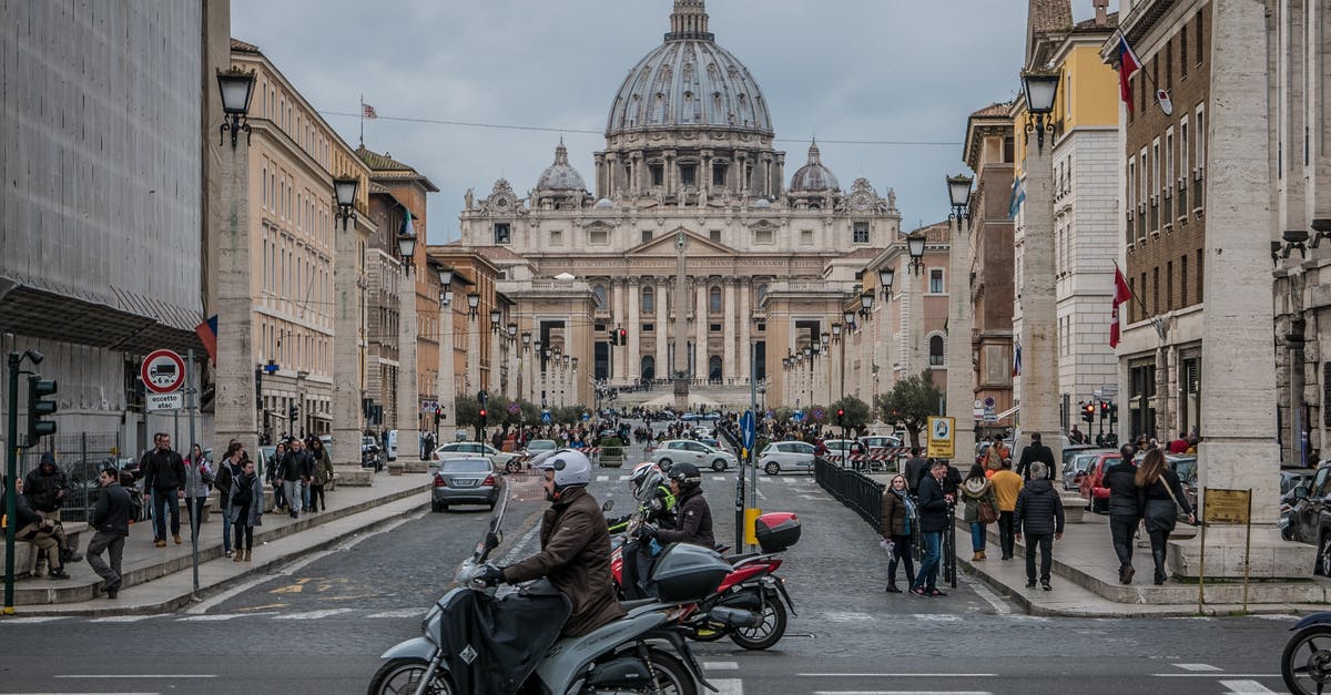 Travel with an Italian residence permit - People in St. Peter's  Square