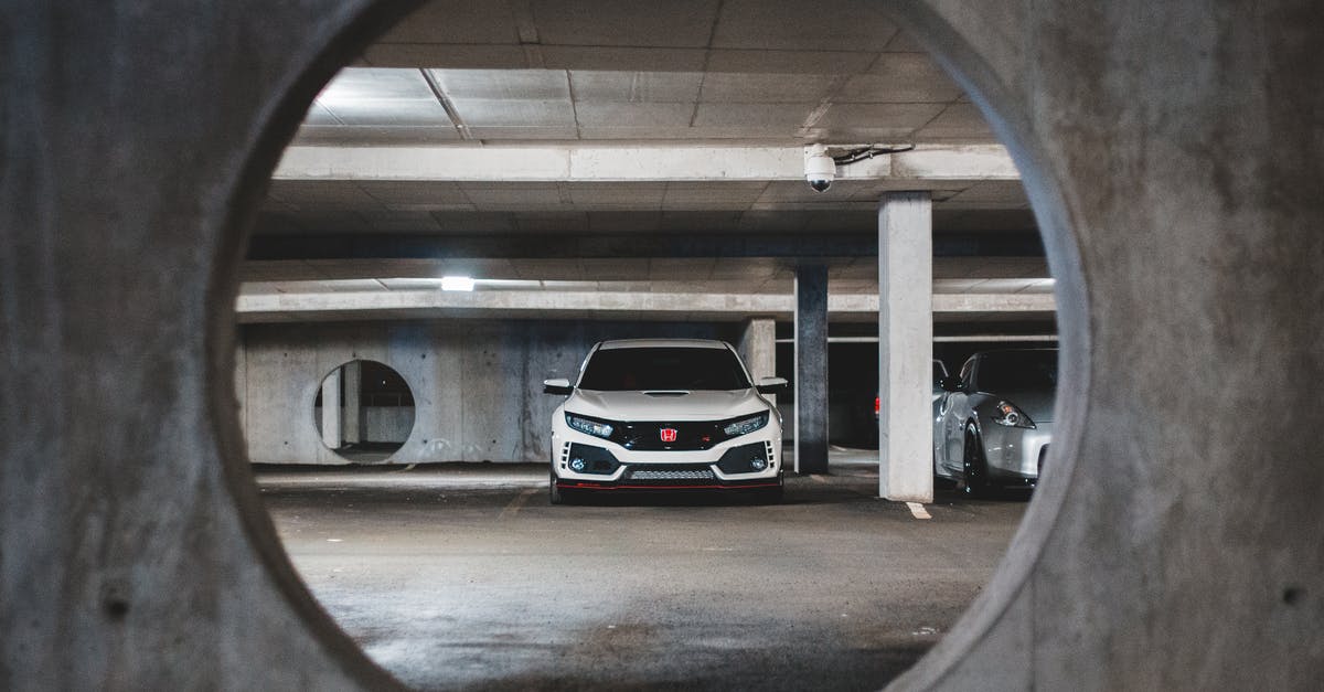 Travel (with public transportation) in New England [closed] - Luxury expensive car placed on concrete cement platform with columns illuminated with bright lamps