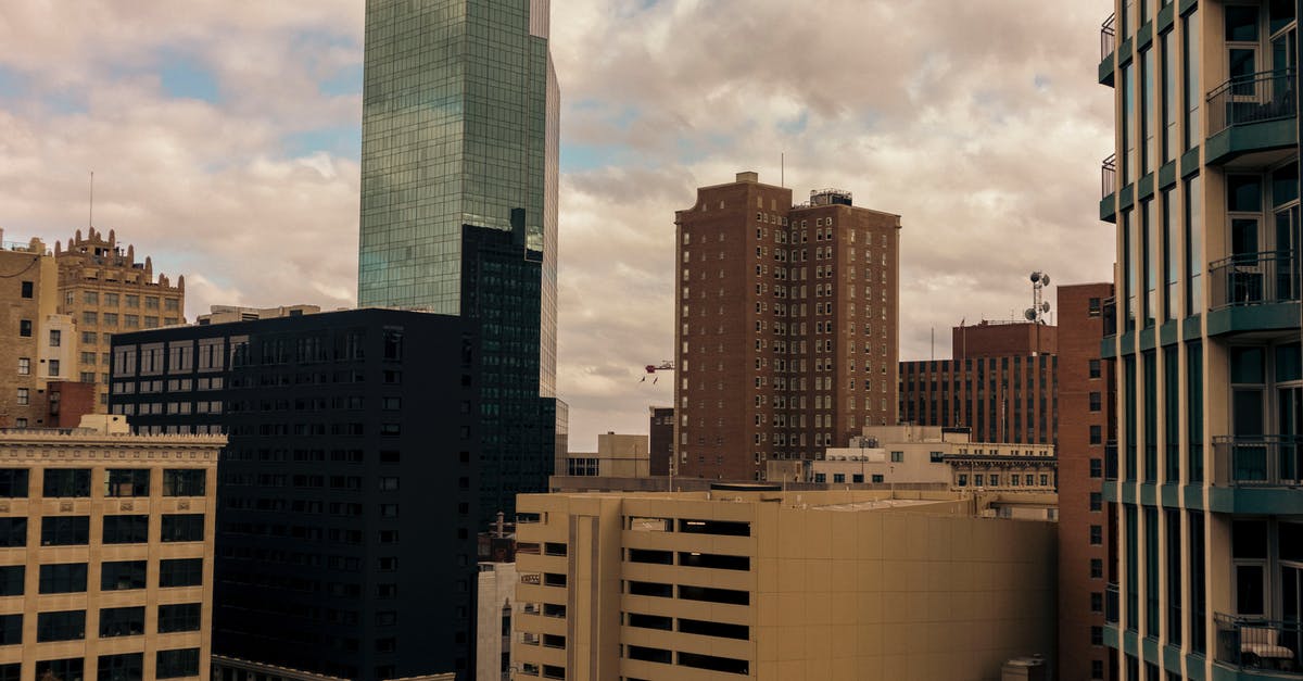 Travel within Schengen Business visa? - White and Brown Concrete Building Under White Clouds