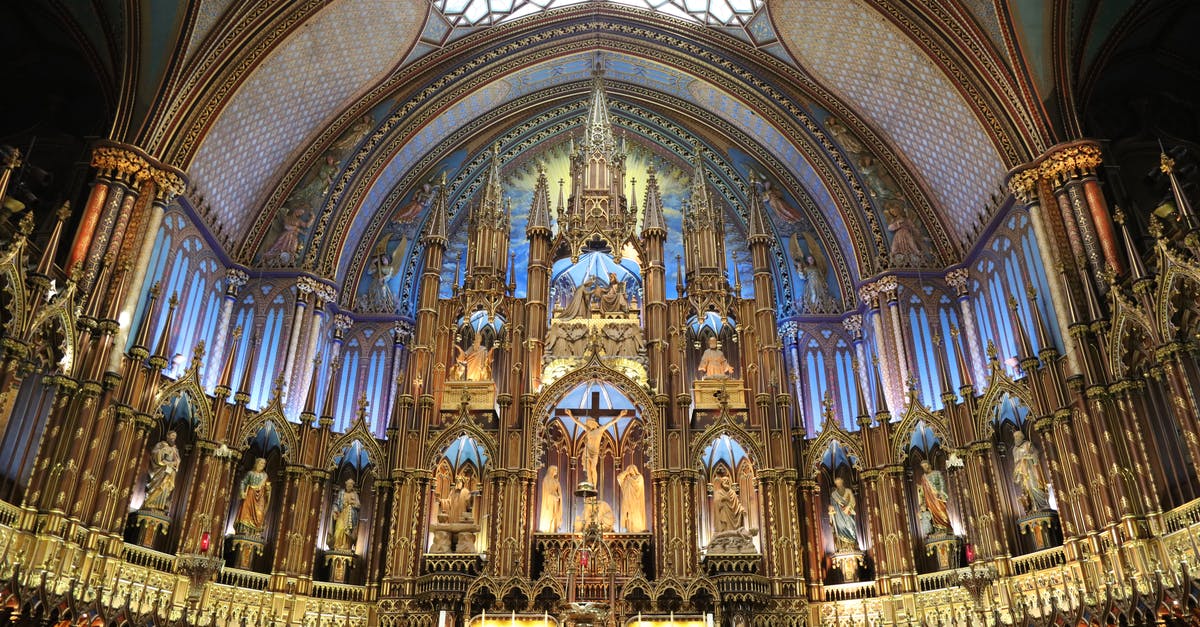 Traveling from Bangkok thu Oman then Germany final destination Canada - From below of ornamental altar with ancient sculptures and arched ceiling inside of famous Cathedral Basilica of Notre Dame de Quebec