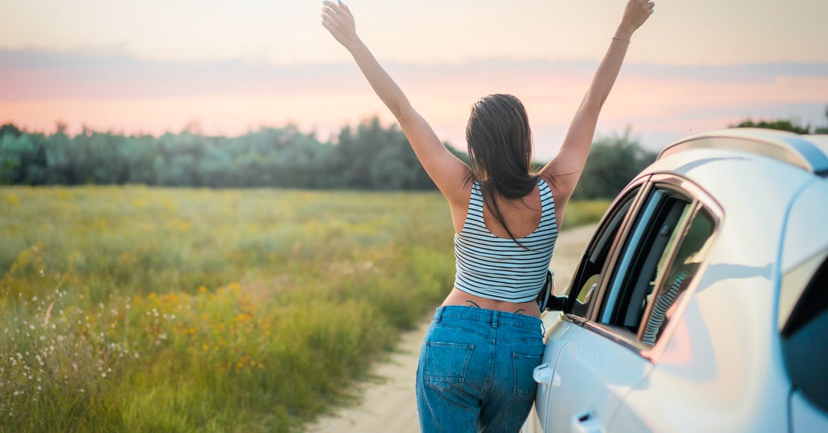 Traveling from Germany to Czech Republic and back by car - Woman Leaning Beside Vehicle