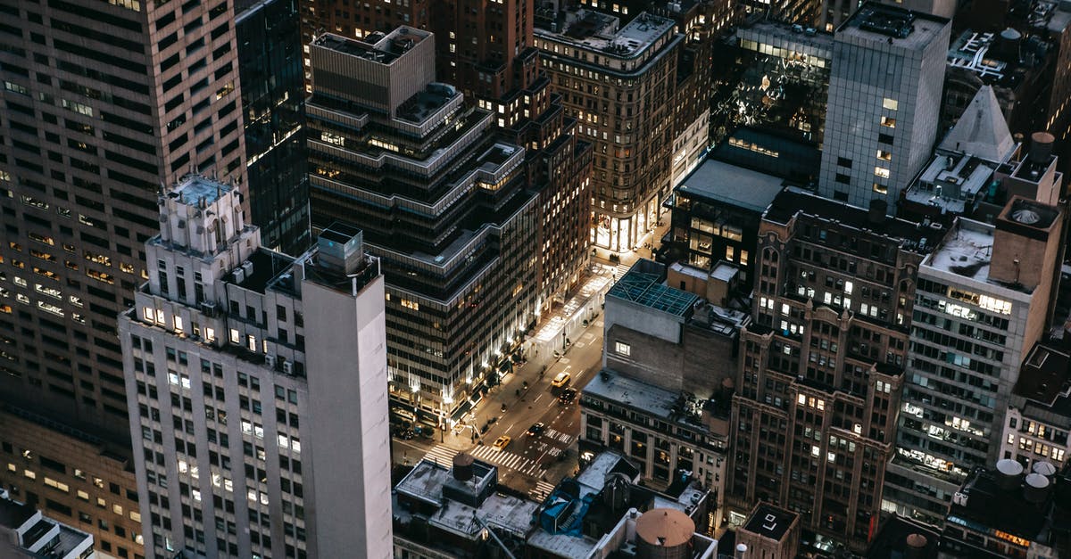 Traveling from JFK to Manhattan with 6 bags - Modern illuminated city district in evening