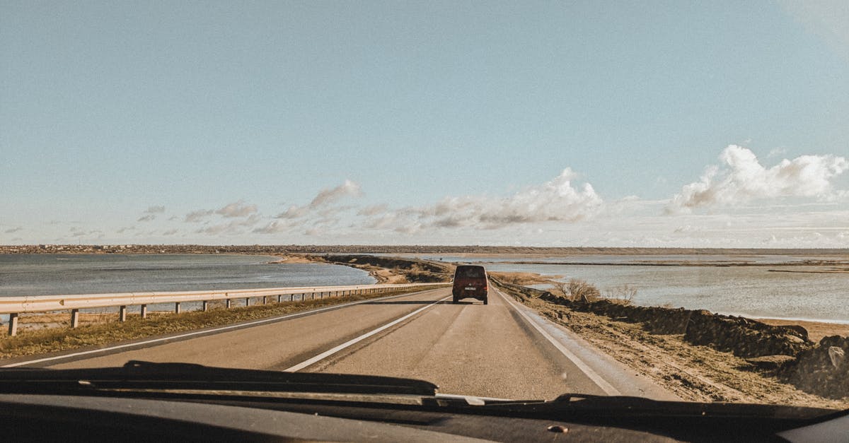 Traveling from Ontario to Buffalo - Black Car on Road