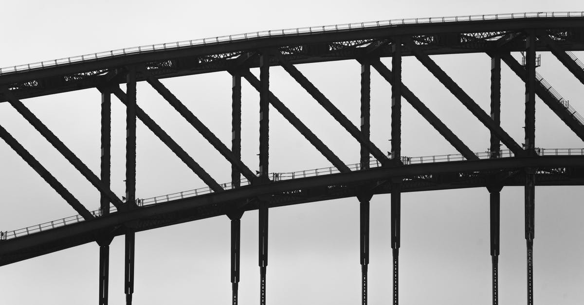 Traveling from Sydney to Mexico via Canada - Fragment of steel arch bridge against overcast sky