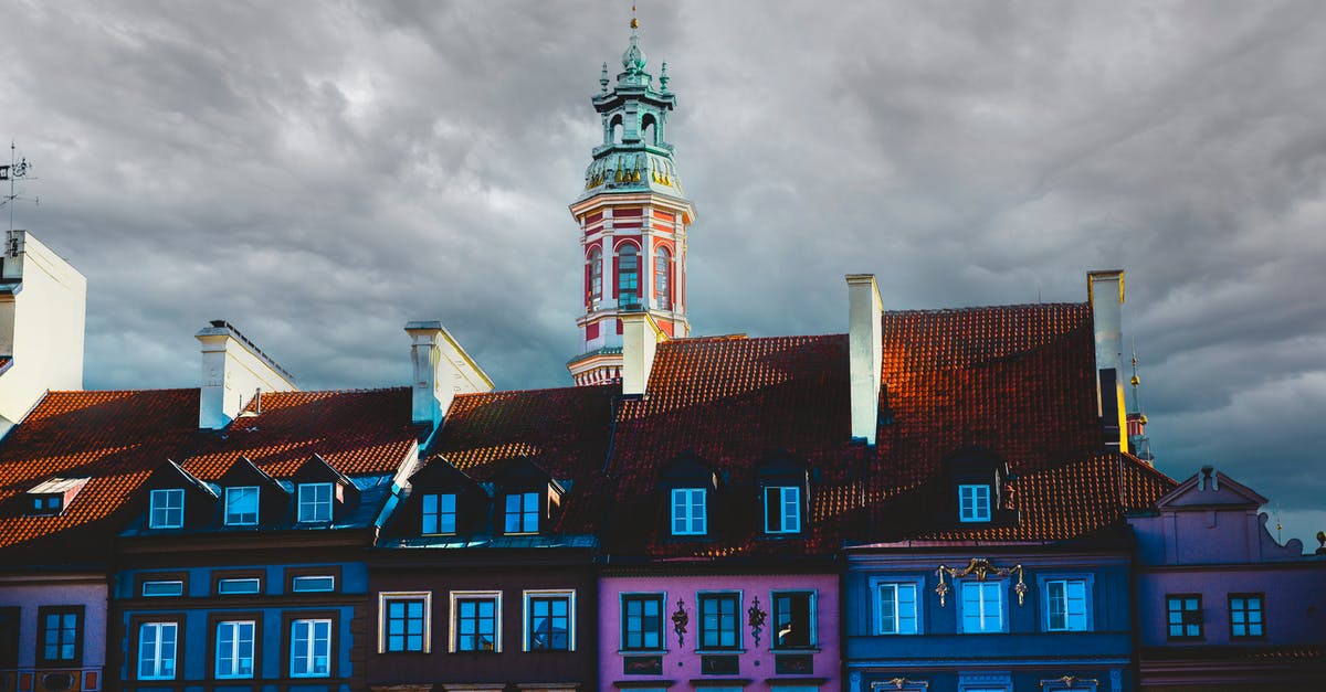 Traveling from Warsaw to Kaliningrad - Blue and Brown Concrete Building Under White Clouds