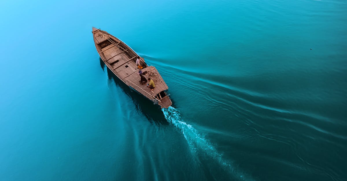 Traveling on a cruise ship from Singapore to Bejing - Boat floating on calm blue seawater