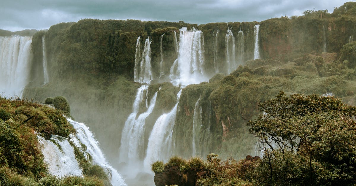 Traveling to Brazil on different passports [duplicate] - Waterfalls Under Cloudy Sky