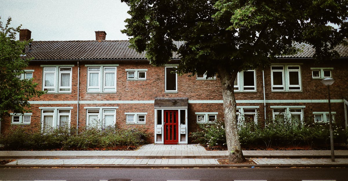 Traveling to Canada with a Netherlands refugee passport - Frontage Of A Concrete Building With Brickwall