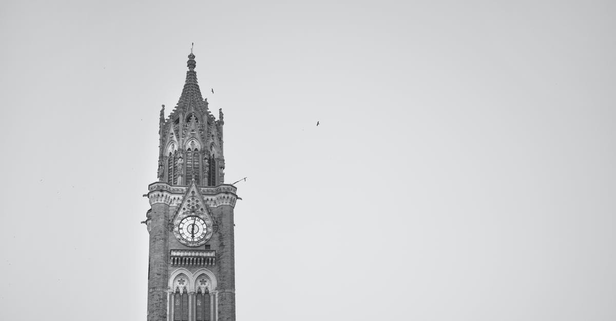 Traveling to India from Europe via london [duplicate] - Grayscale Photo of Clock Tower