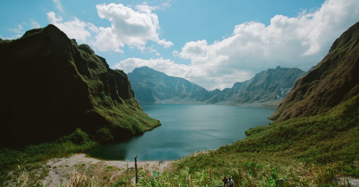 Traveling to Philippines - Photography of Mountains Near Body of Water