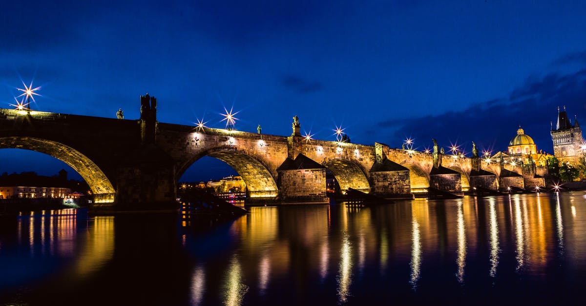 Traveling to prague with a Hungary Schengen Visa - Brown and Black Concrete Bridge during Night