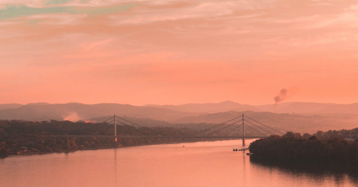 Traveling to Serbia - Body of Water Near Mountain during Sunset