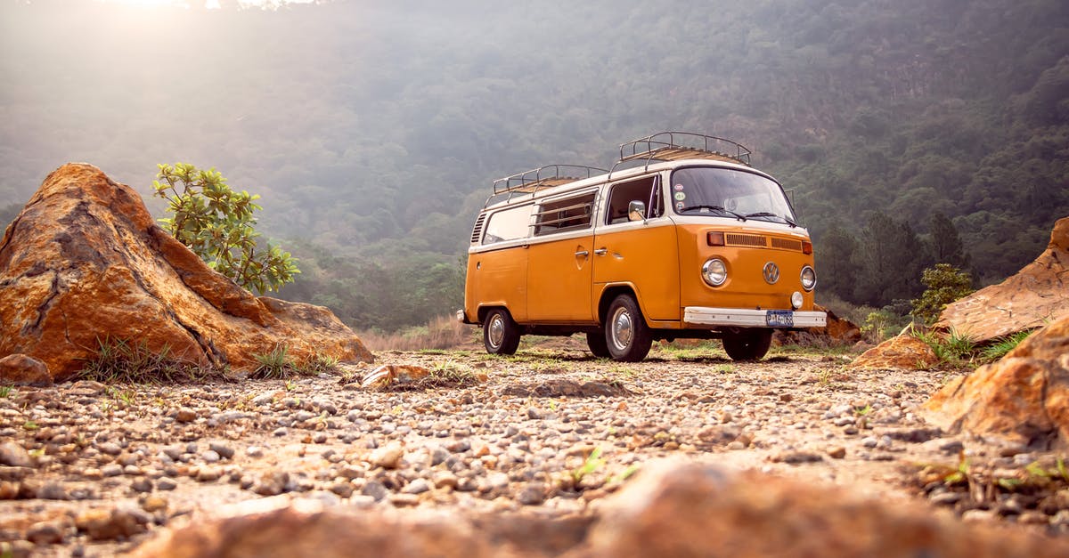 Traveling to Sulina (Romania) by car - Low Angle Photo of Volkswagen Kombi