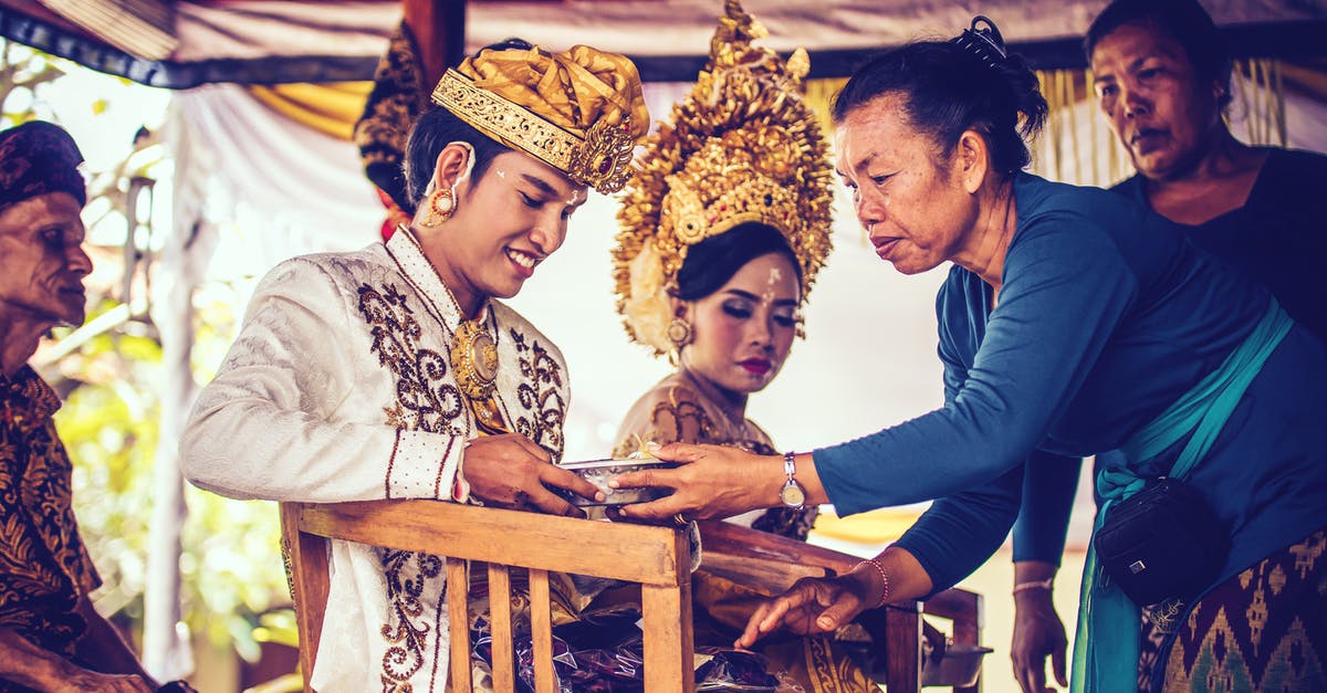 Travelling as unmarried couple in Indonesia [duplicate] - Man and Woman Sitting on Chair Close-up Photography