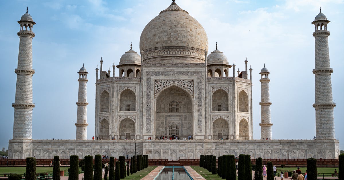 Travelling before entering India with UK visa - White Concrete Building Under Blue Sky