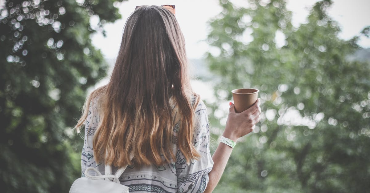 Travelling on Advance Parole [closed] - Woman Holding Brown Paper Cup