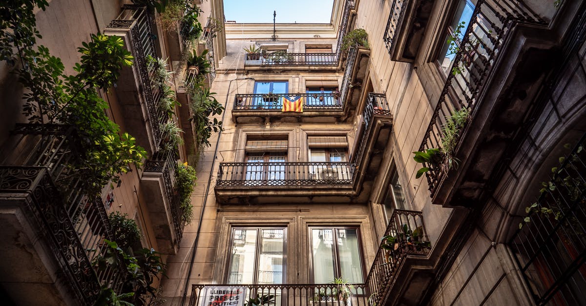 Travelling to Algeria through Barcelona - Low-angle Photography of Brown Building