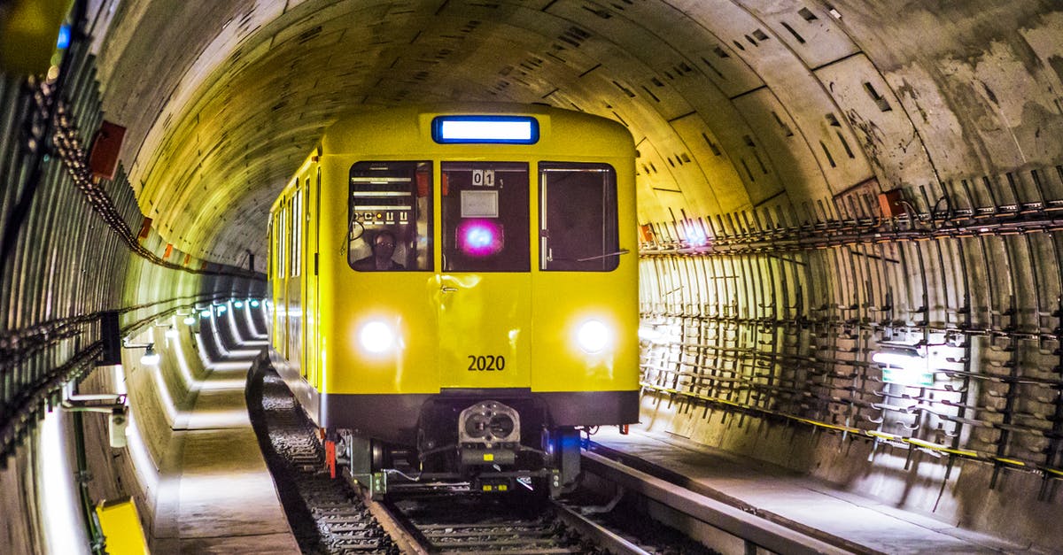 Travelling to Berlin without a bank statement - Yellow and Black Train Under Tunnel