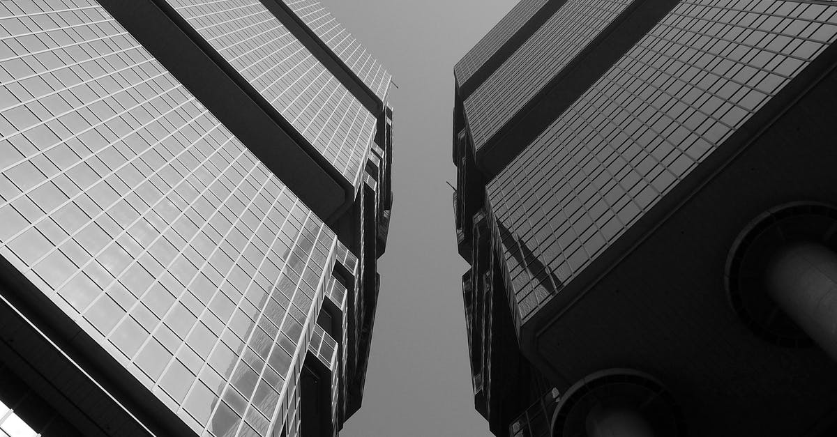 Travelling to China / Hong Kong with criminal conviction from Australia - Symmetric twin skyscrapers in downtown on sunny day