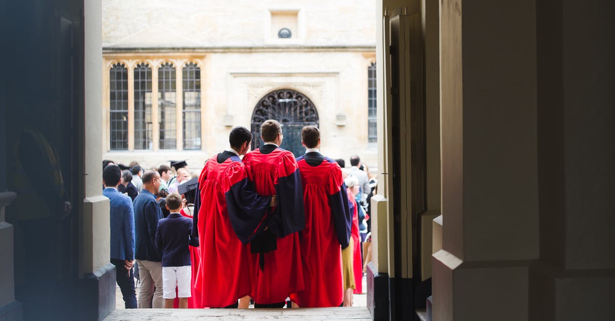 Travelling to Europe before student visa [closed] - Faceless men in red cloaks standing on crowded square