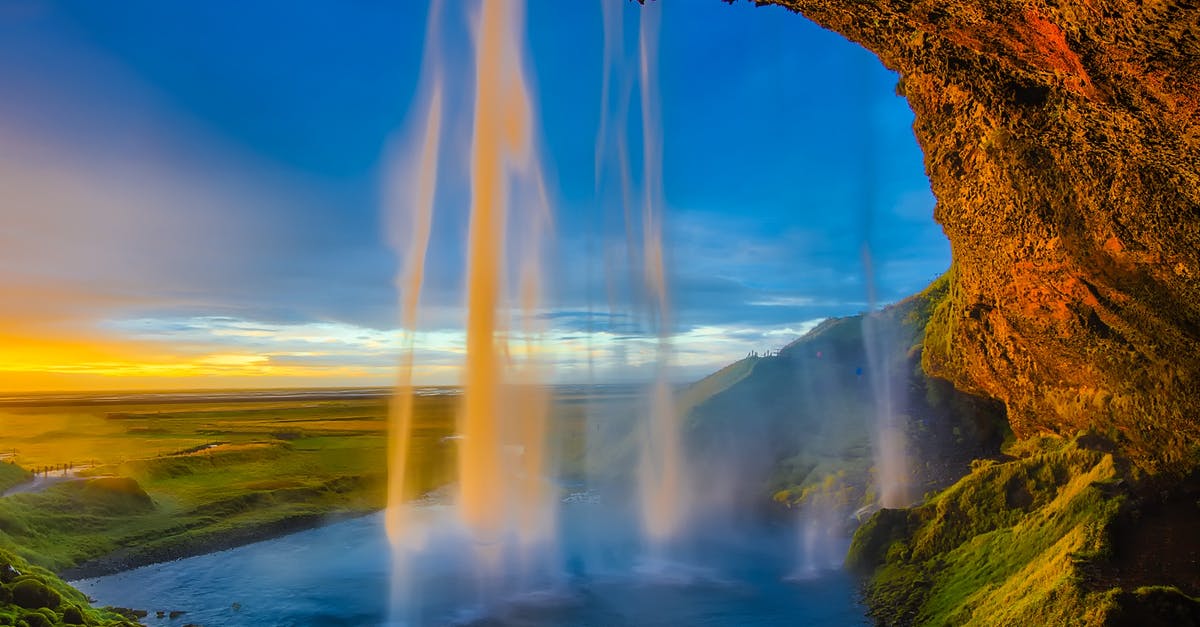 Travelling to Iceland and UK - Brown Rocky Mountain With Waterfalls