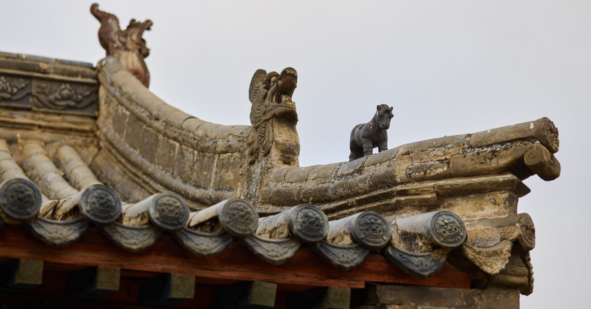Travelling to Kyzyl, Tuva from Mörön, Mongolia - Details of old oriental temple against cloudy sky